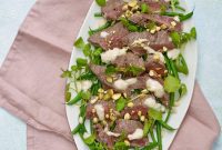 Seared Steak with Horseradish Kick, Garlicky Greens, and Toasted Pistachios