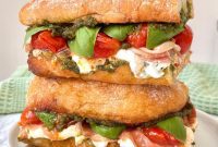 Burrata Caprese Prosciutto Sandwich Drizzled with Pistachio Pesto