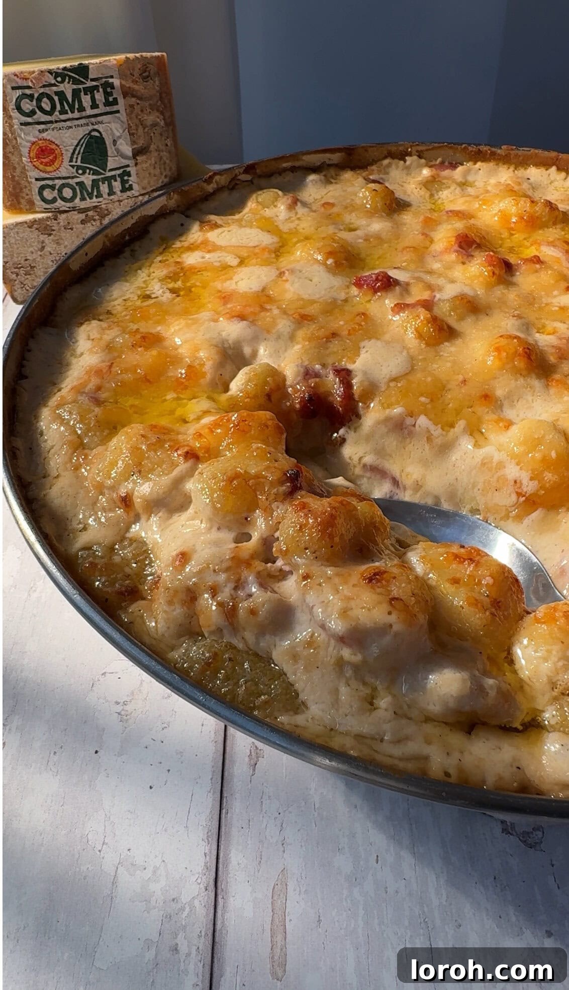 Close-up of baked Gnocchiflette with golden cheese topping.