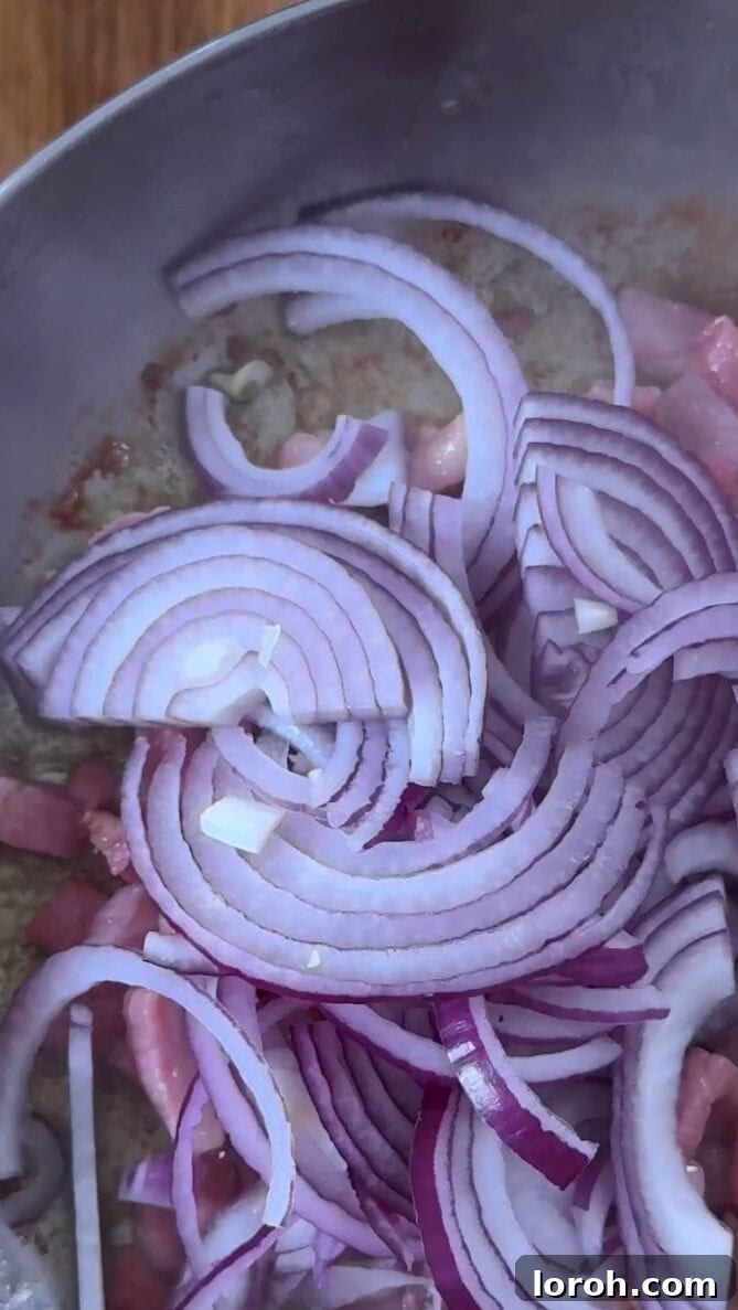 Step two: Sautéing onions and garlic with bacon lardons.