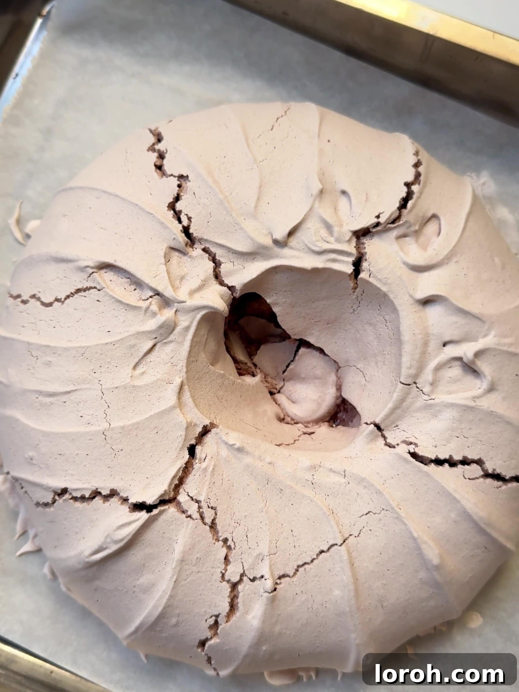 Holiday Spiced Pear Cloud 15 Cooling the Christmas Pavlova on a baking tin.