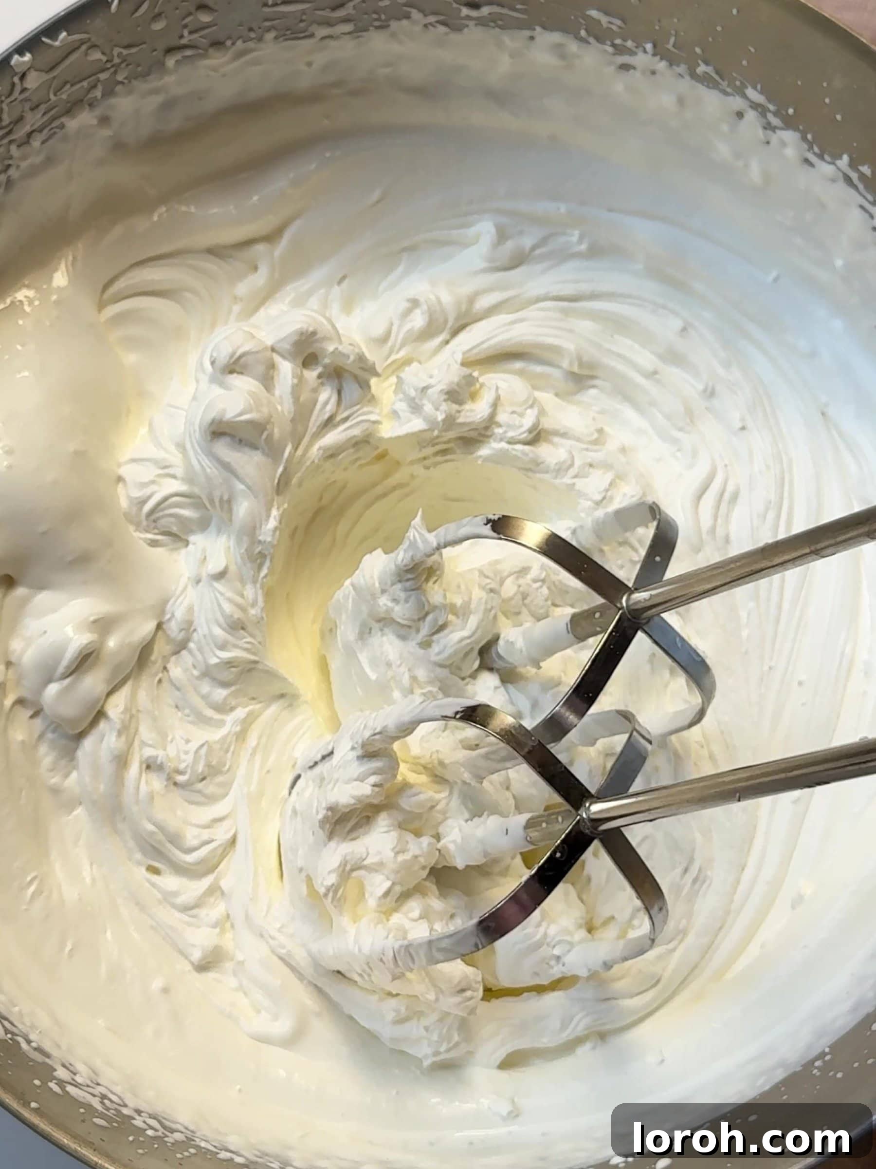 Holiday Spiced Pear Cloud 18 Whipping cream in a mixing bowl.