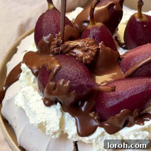 Drizzling chocolate sauce over poached pear Pavlova.