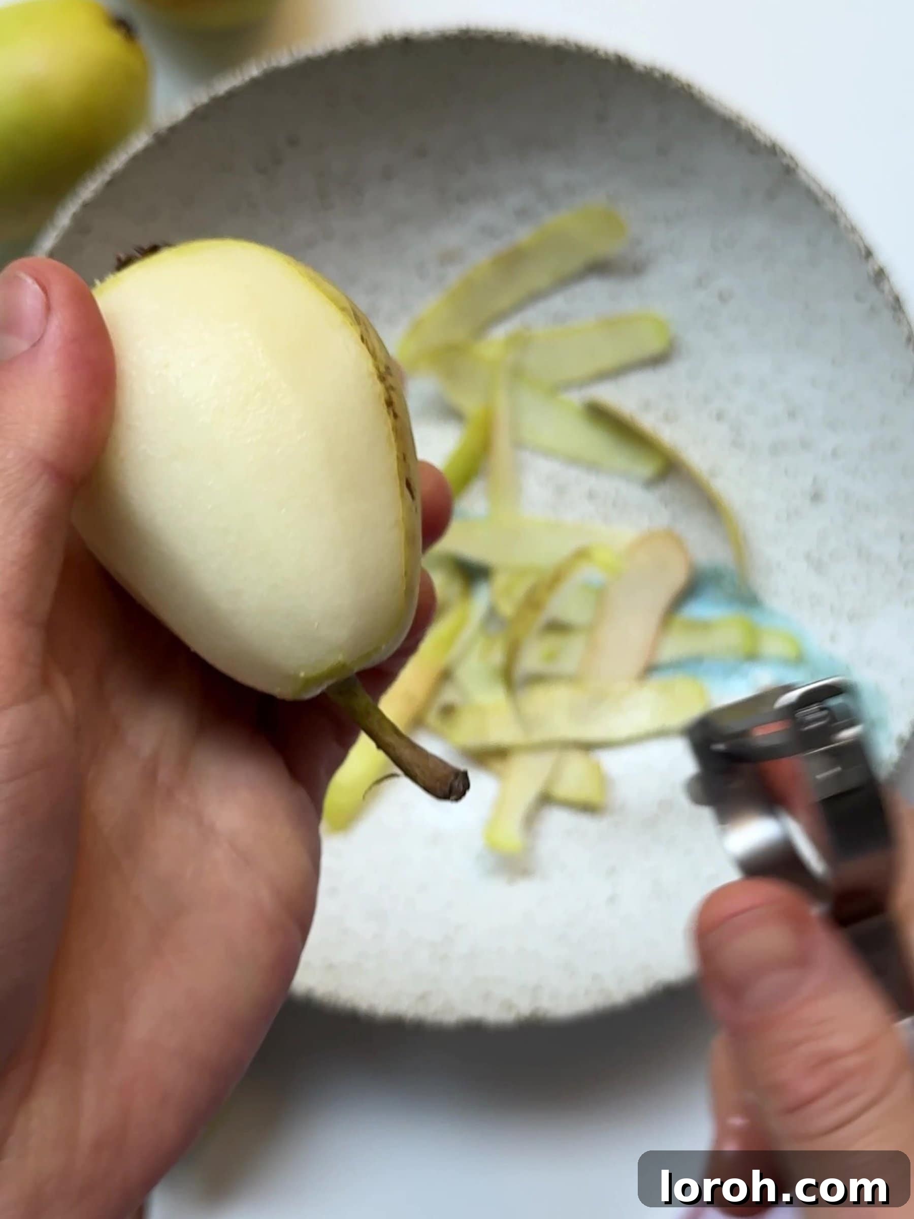 Holiday Spiced Pear Cloud 5 Peeling pears with a peeler.