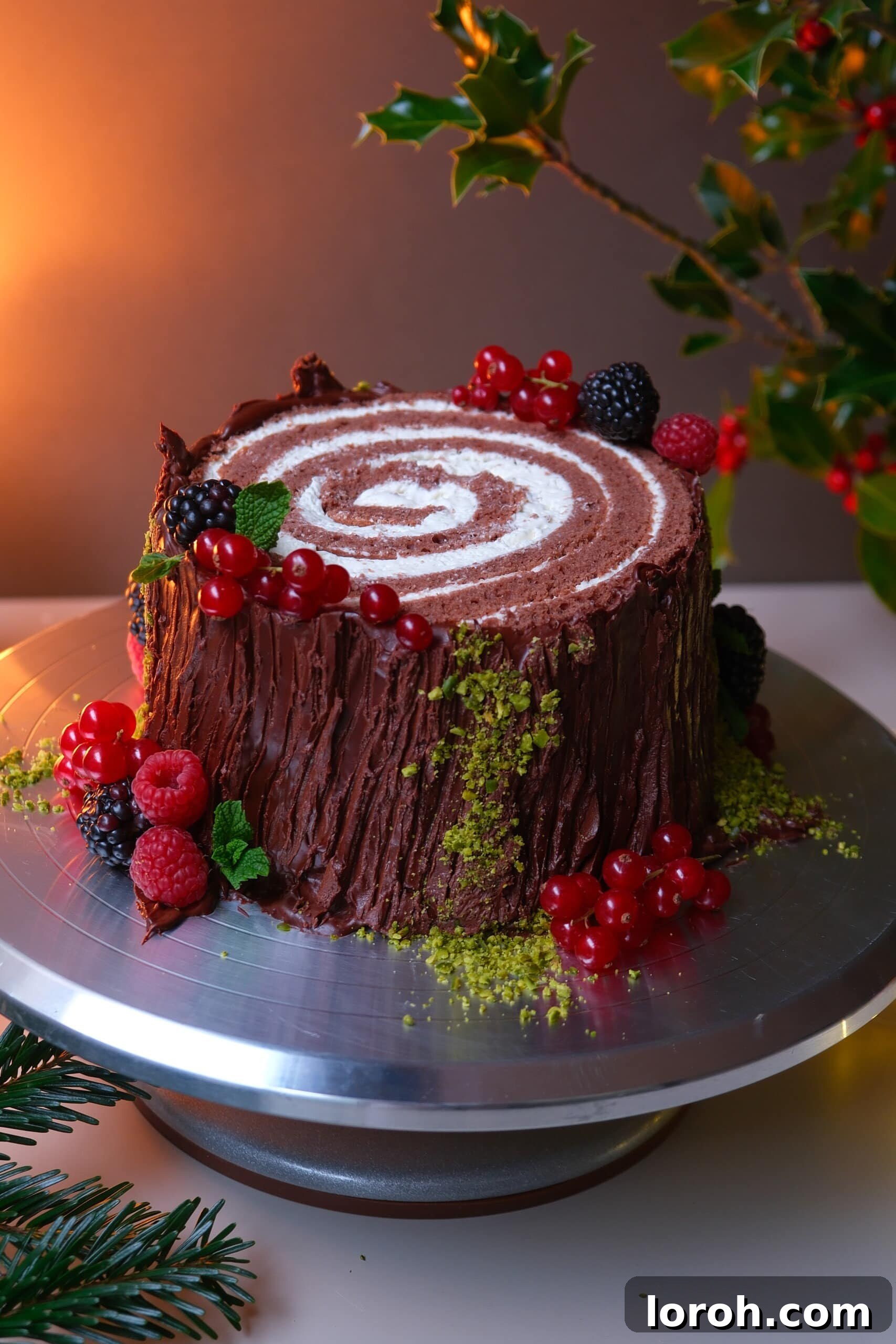 Winter Woodland Roll 2 buche de noel on a plate with berries.