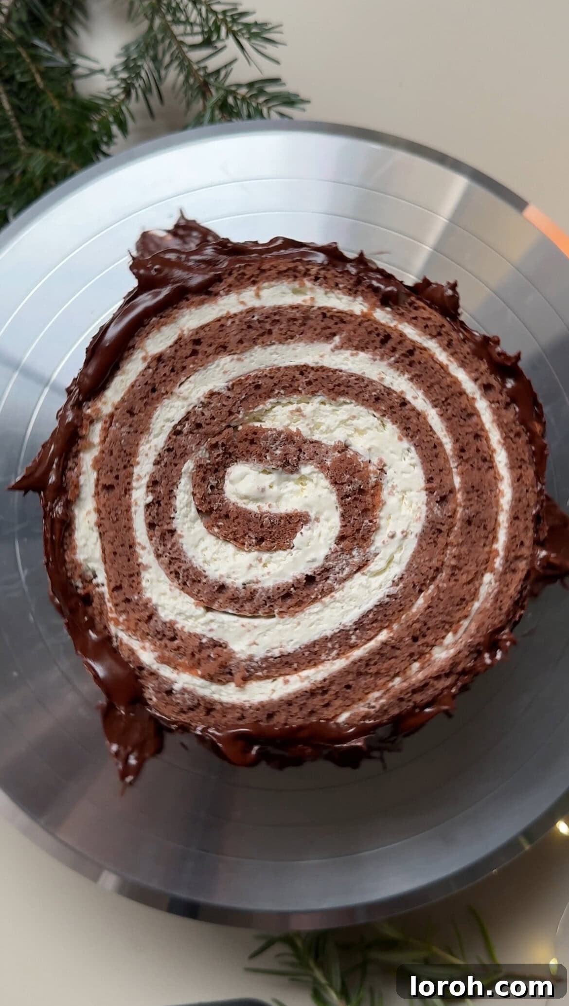 Winter Woodland Roll 17 decorating with ganache.