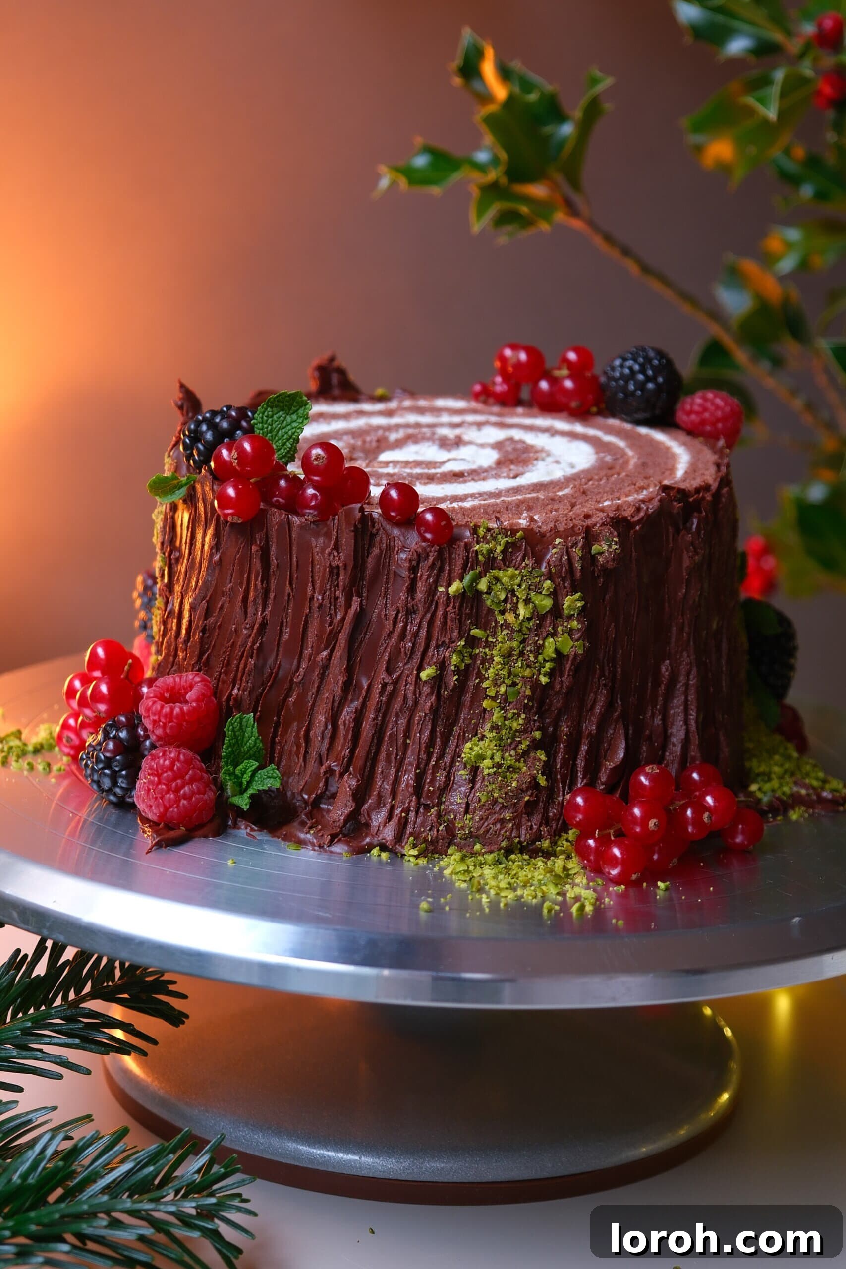 Winter Woodland Roll 3 buche de noel on a plate with berries.