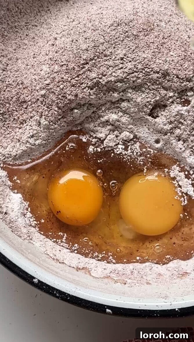 Winter Woodland Roll 6 adding eggs to flour.