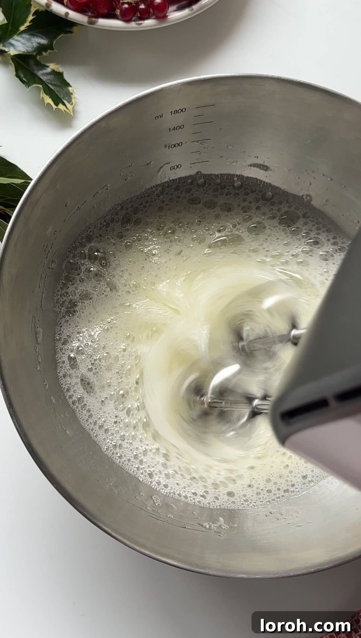 Winter Woodland Roll 8 whipping egg whites to soft peaks.