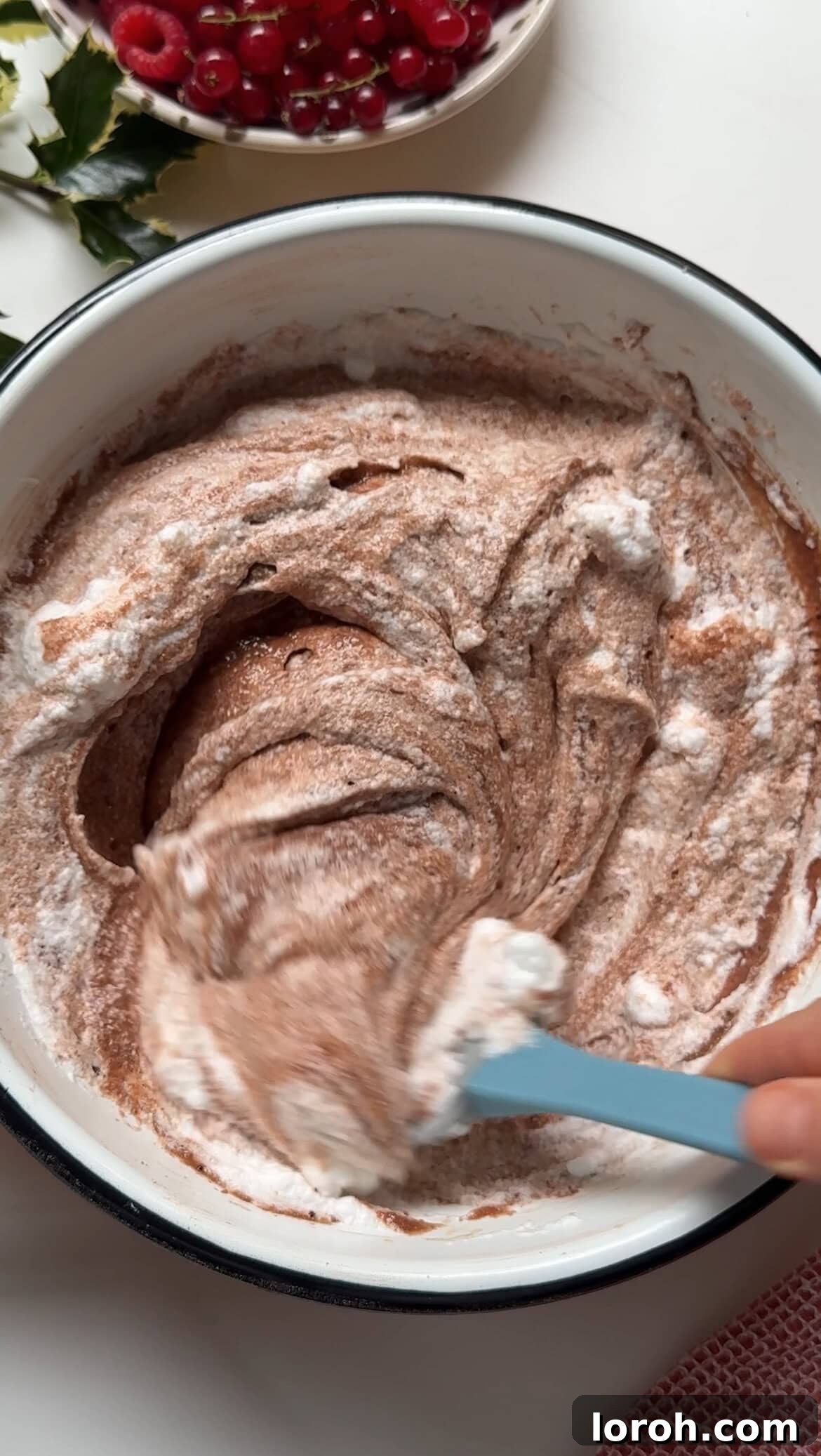 Winter Woodland Roll 10 folding egg whites into the chocolate batter.