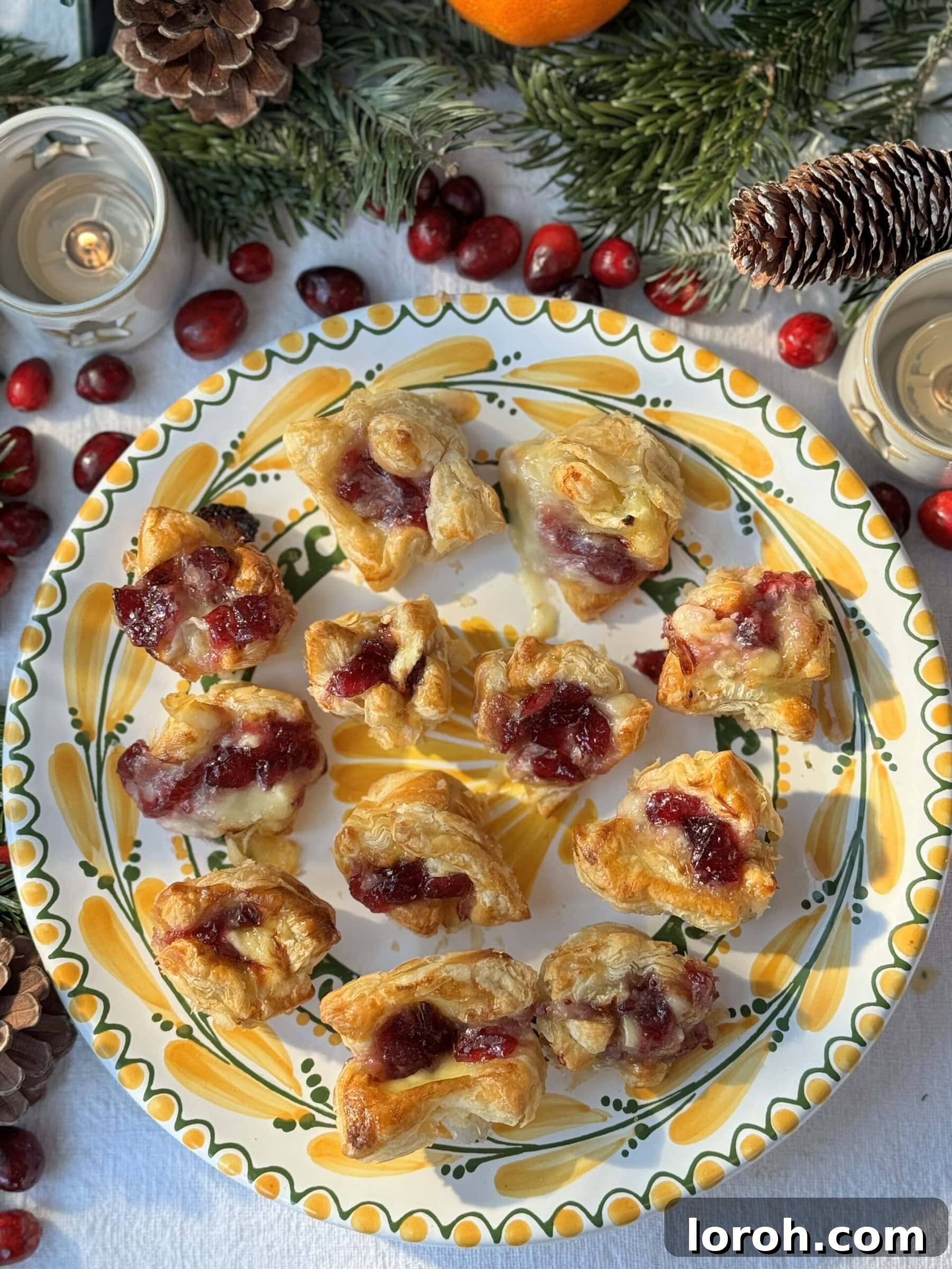 Golden Flaky Brie Bites 2 Brie Puff Pastry Bites on a platter, ready to serve.