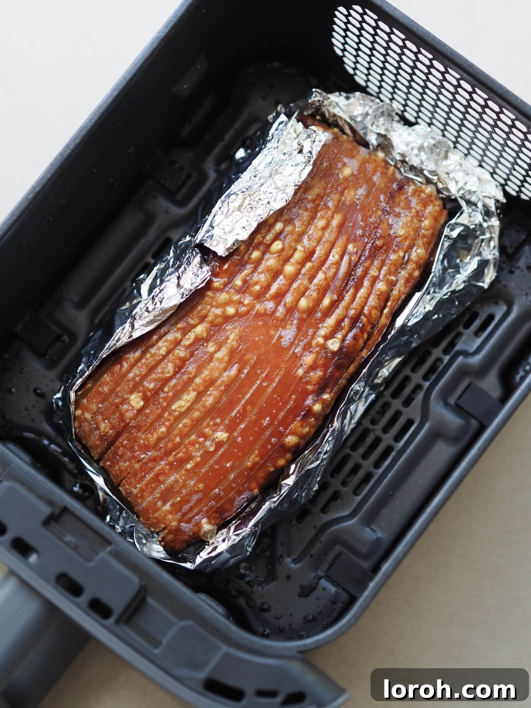 Crispy air fryer pork belly slices after cooking.