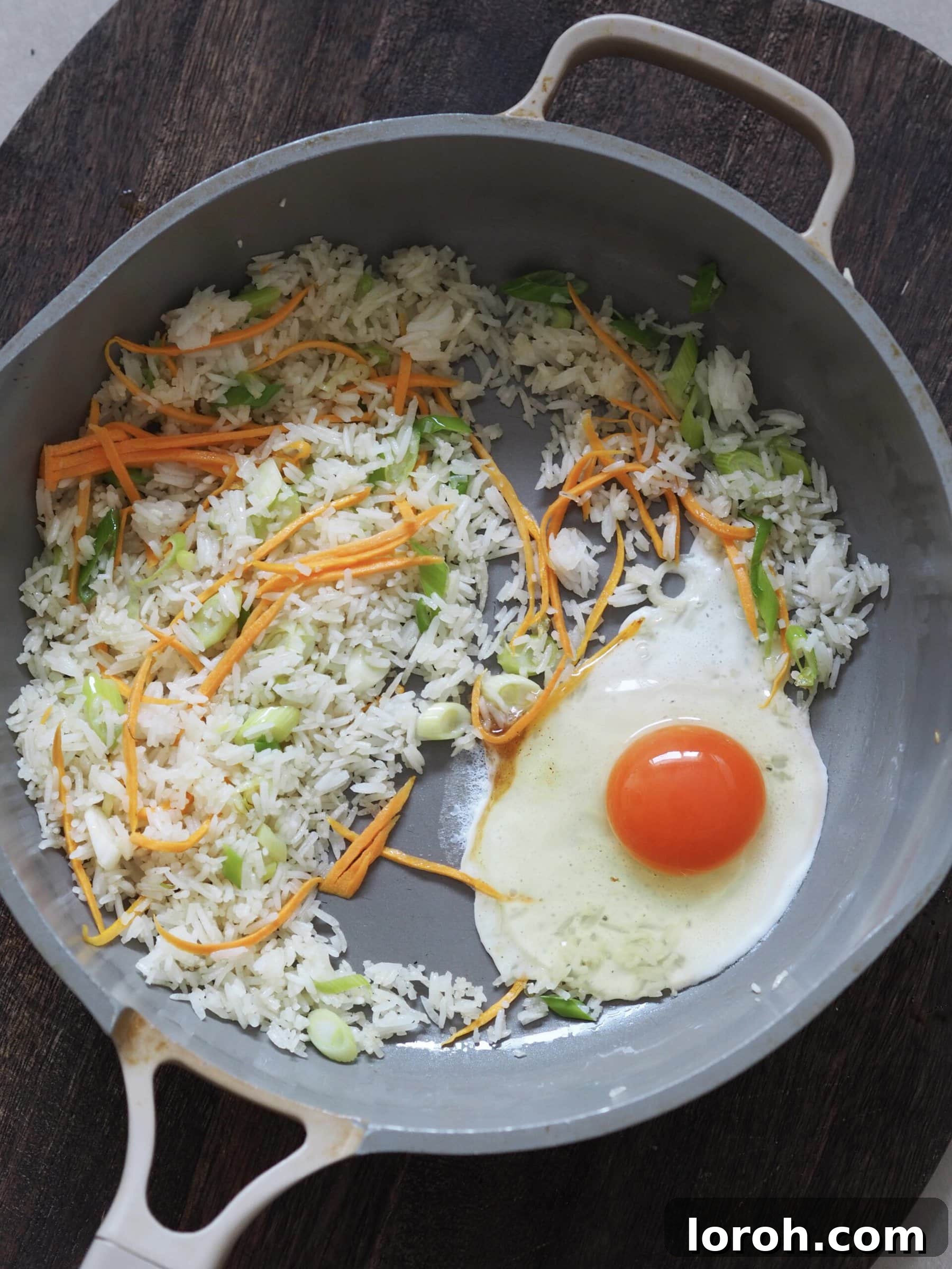 Frying an egg for egg fried rice.