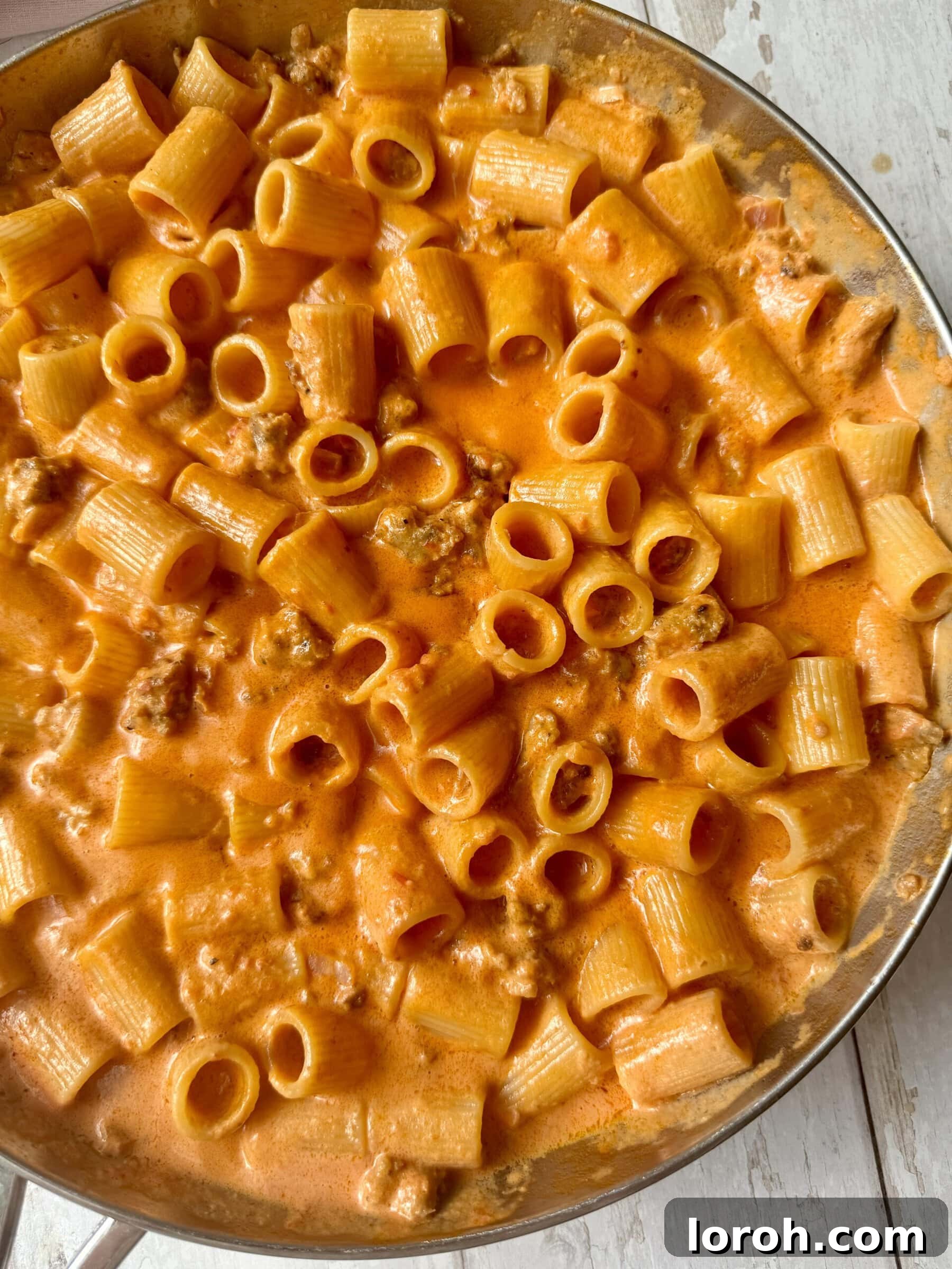 Velvet Vodka Chicken Pasta 3 Chicken and vodka pasta simmering in the pan, showing the rich, creamy sauce.