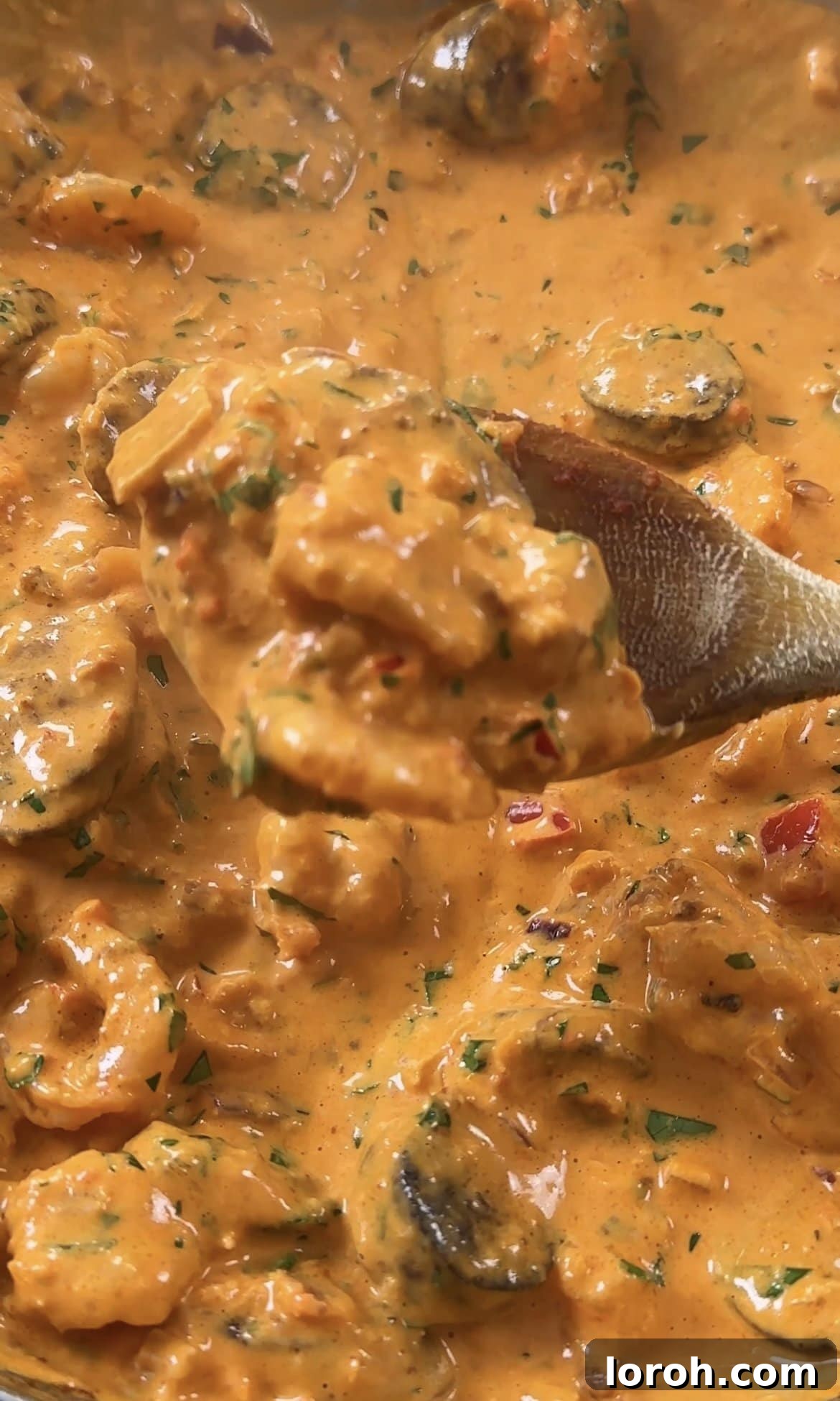 Smoky Chorizo Prawn Pasta 9 Stirring cooked prawns and chorizo back into the simmering creamy sauce.