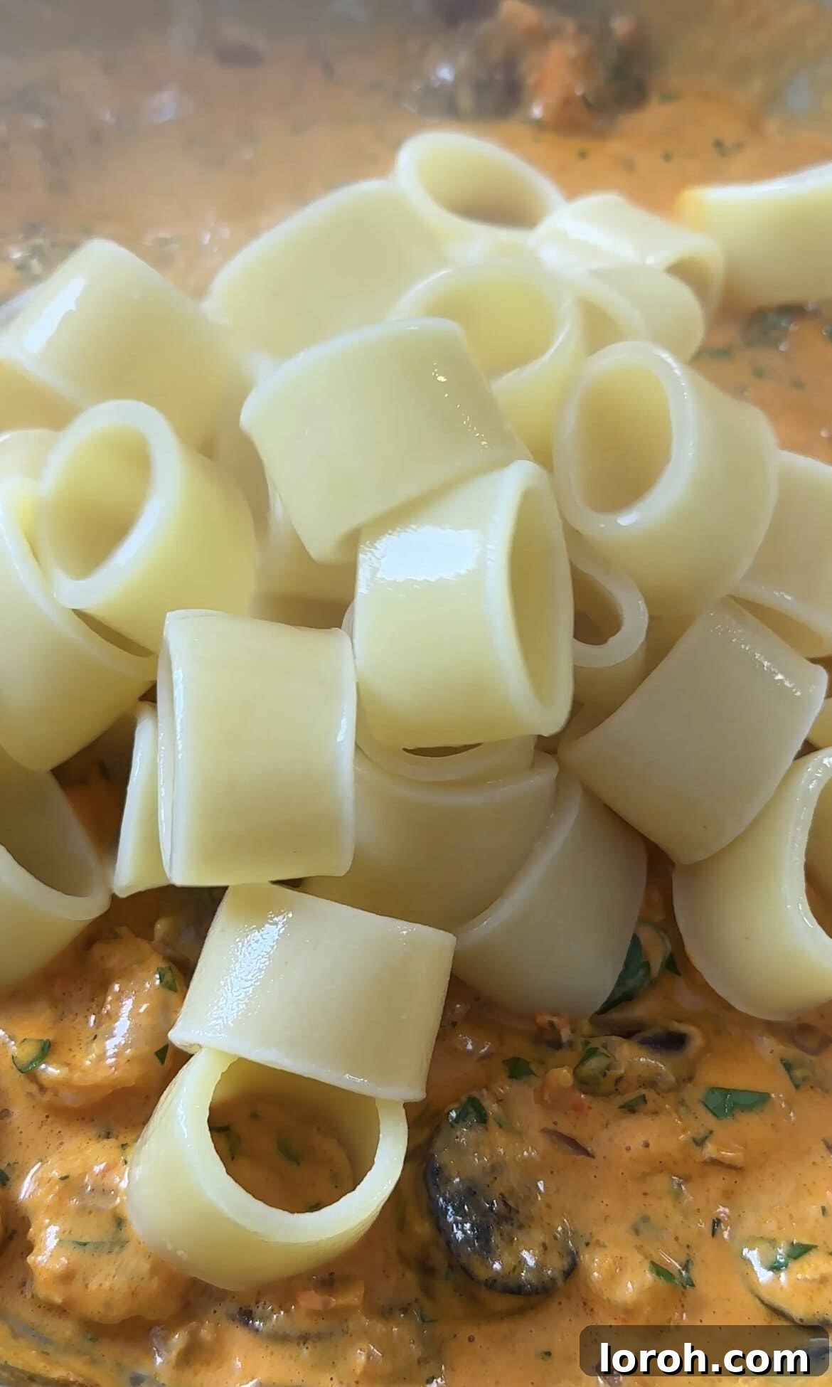 Smoky Chorizo Prawn Pasta 10 Adding drained pasta to the rich prawn and chorizo creamy sauce.