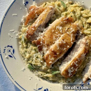 lemon chicken orzo in a bowl with blue flowers.