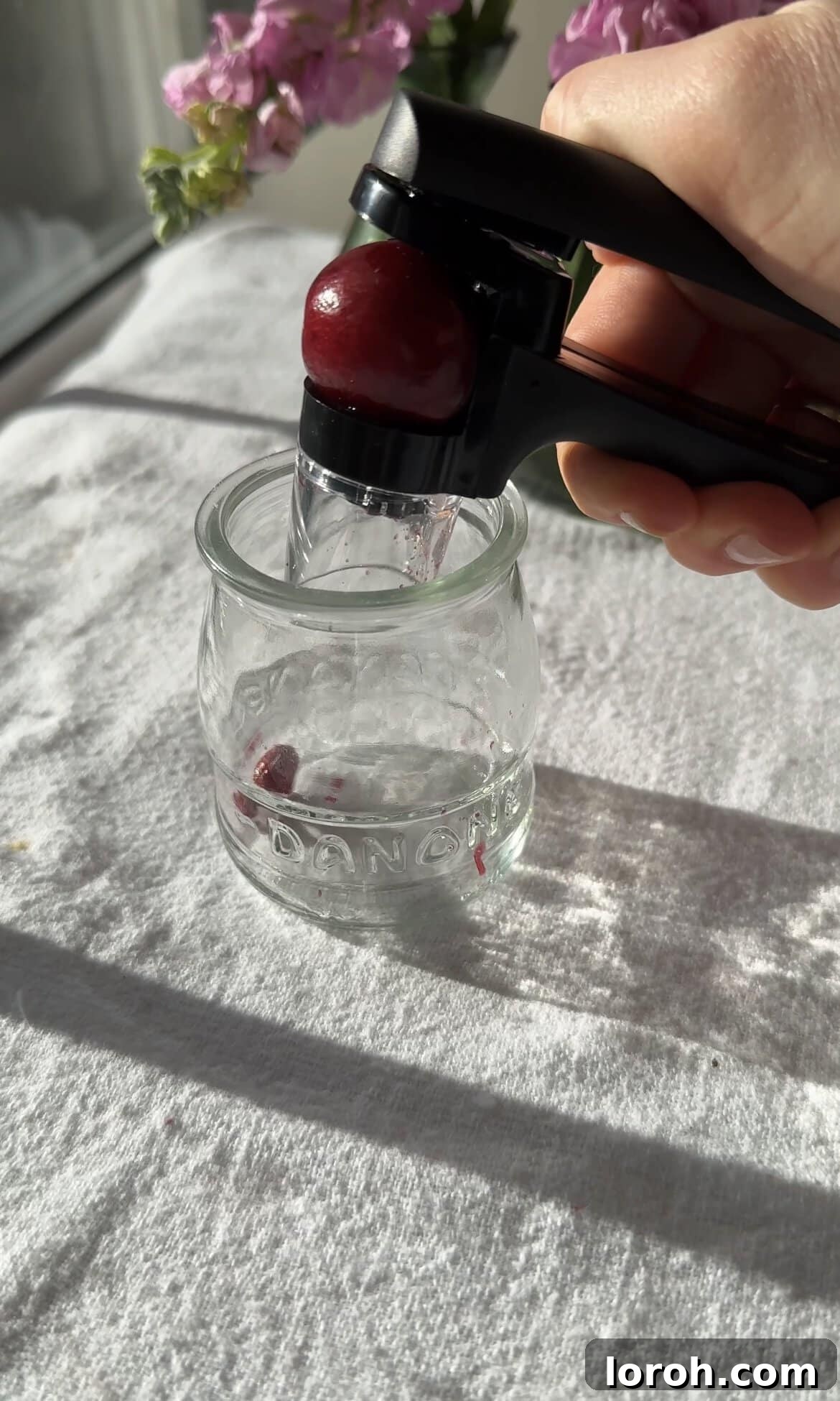 Classic French Cherry Clafoutis 5 Step two: Pitting cherries and spreading them evenly in the prepared dish.