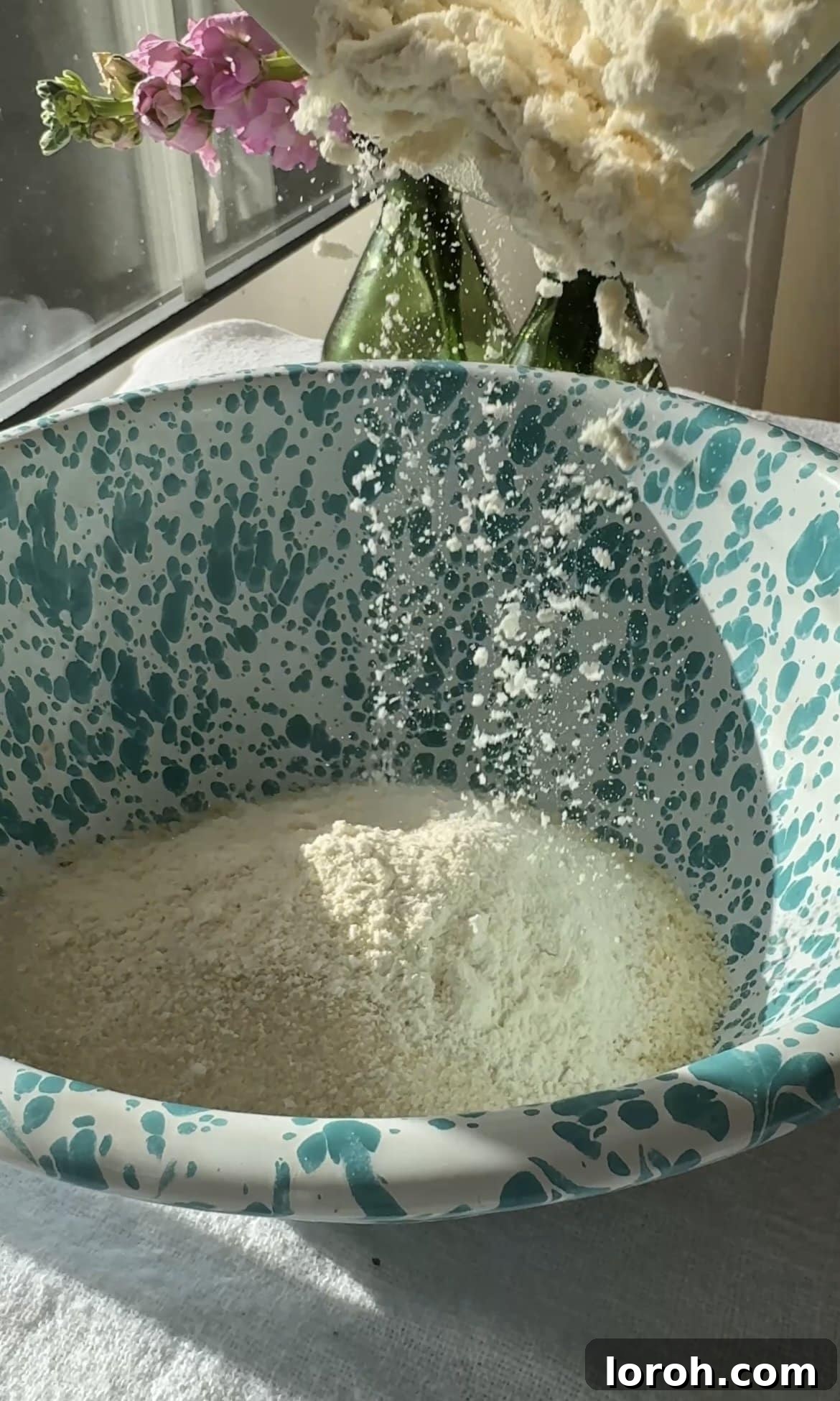 Classic French Cherry Clafoutis 6 Step three: Mixing dry ingredients - flour, ground almonds, and caster sugar in a bowl.