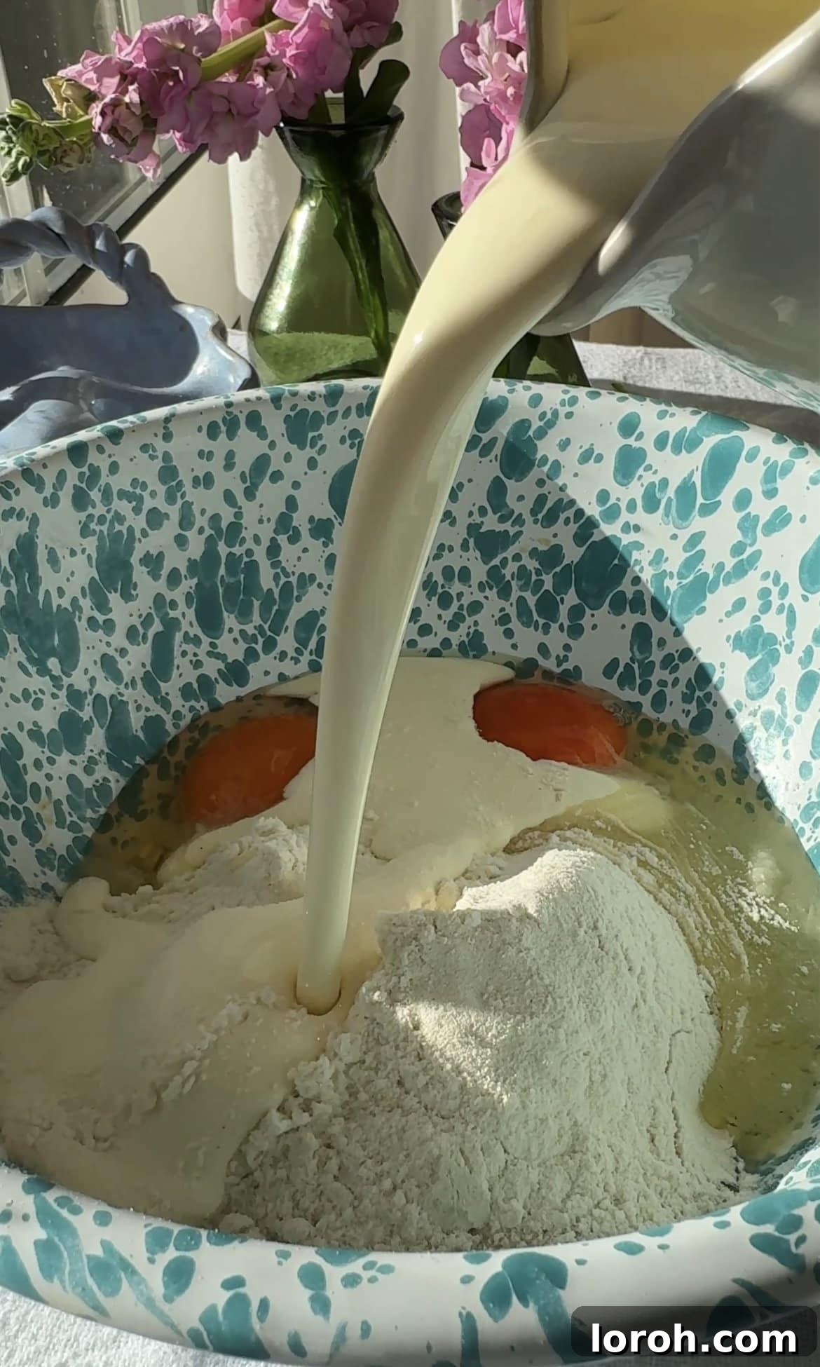 Classic French Cherry Clafoutis 7 Step four: Adding wet ingredients - cream, eggs, and vanilla extract to the dry mixture.