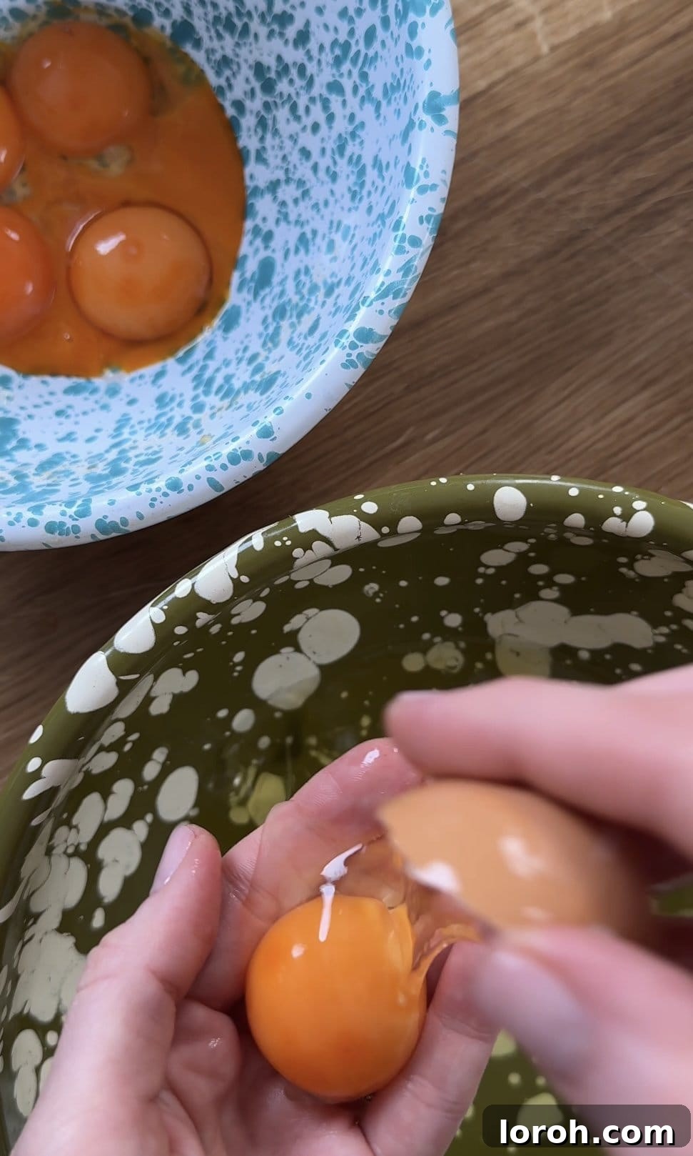 Carefully separating egg whites from egg yolks, ensuring no yolk contamination.