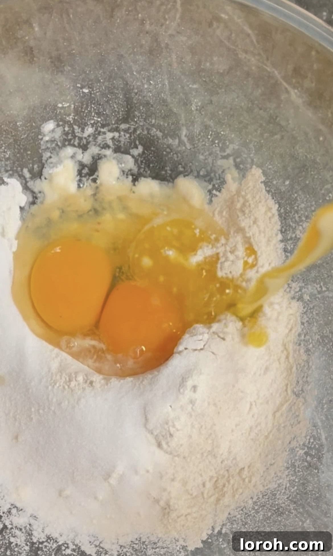 Golden Banana Crêpes 4 Mixing flour, sugar, salt, eggs, and melted butter to create the smooth crepe batter base.
