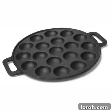 A pristine white poffertjes pan, presented as a studio cutout, ready for use.