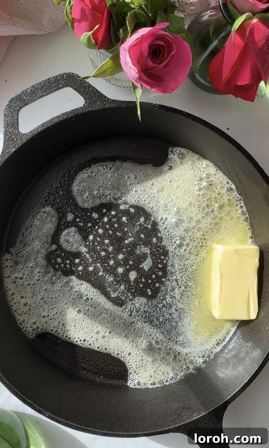 Pannukakku: Finland's Golden Oven-Baked Delight 11 melting butter in the pan.