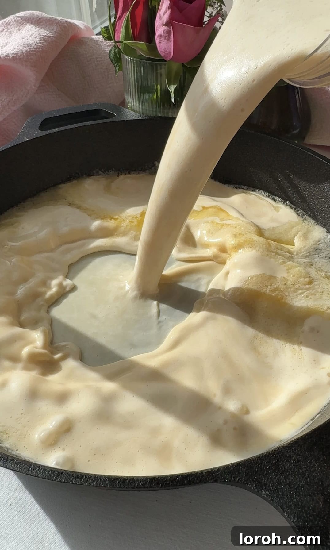 Pannukakku: Finland's Golden Oven-Baked Delight 12 pannukakku batter adding to pan.