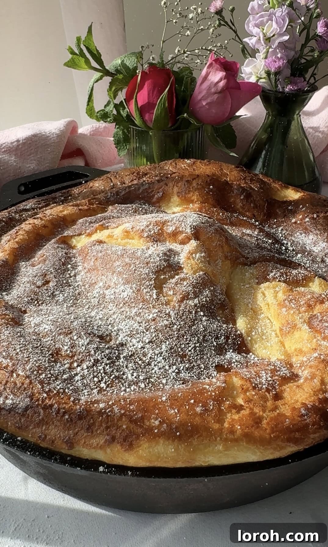 Pannukakku: Finland's Golden Oven-Baked Delight 13 dusting pannukakku with icing sugar.