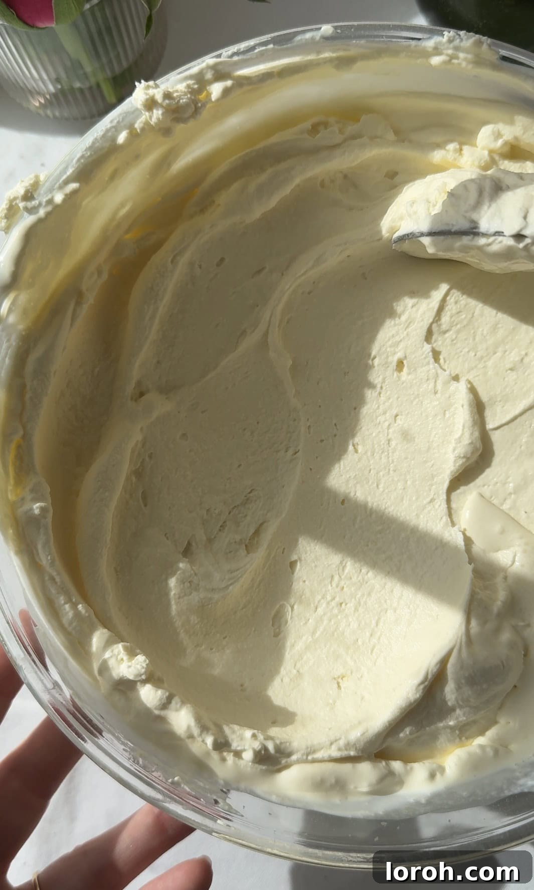 finished whipped mascarpone cream in a bowl, ready to serve.