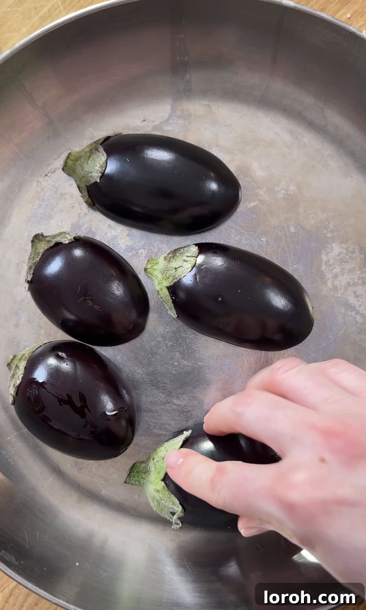 Frying miso aubergine cut side down.