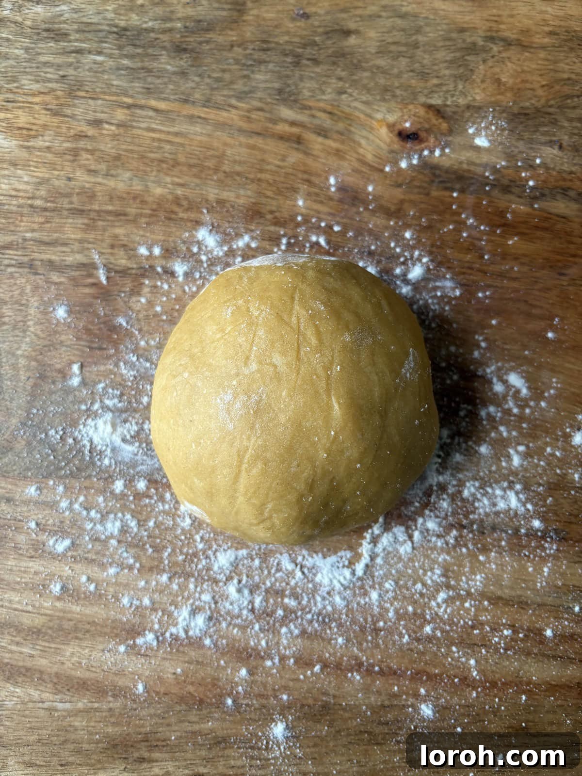 The Art of Homemade Pasta Dough 2 perfectly rolled ball of silky pasta dough, ready for shaping.