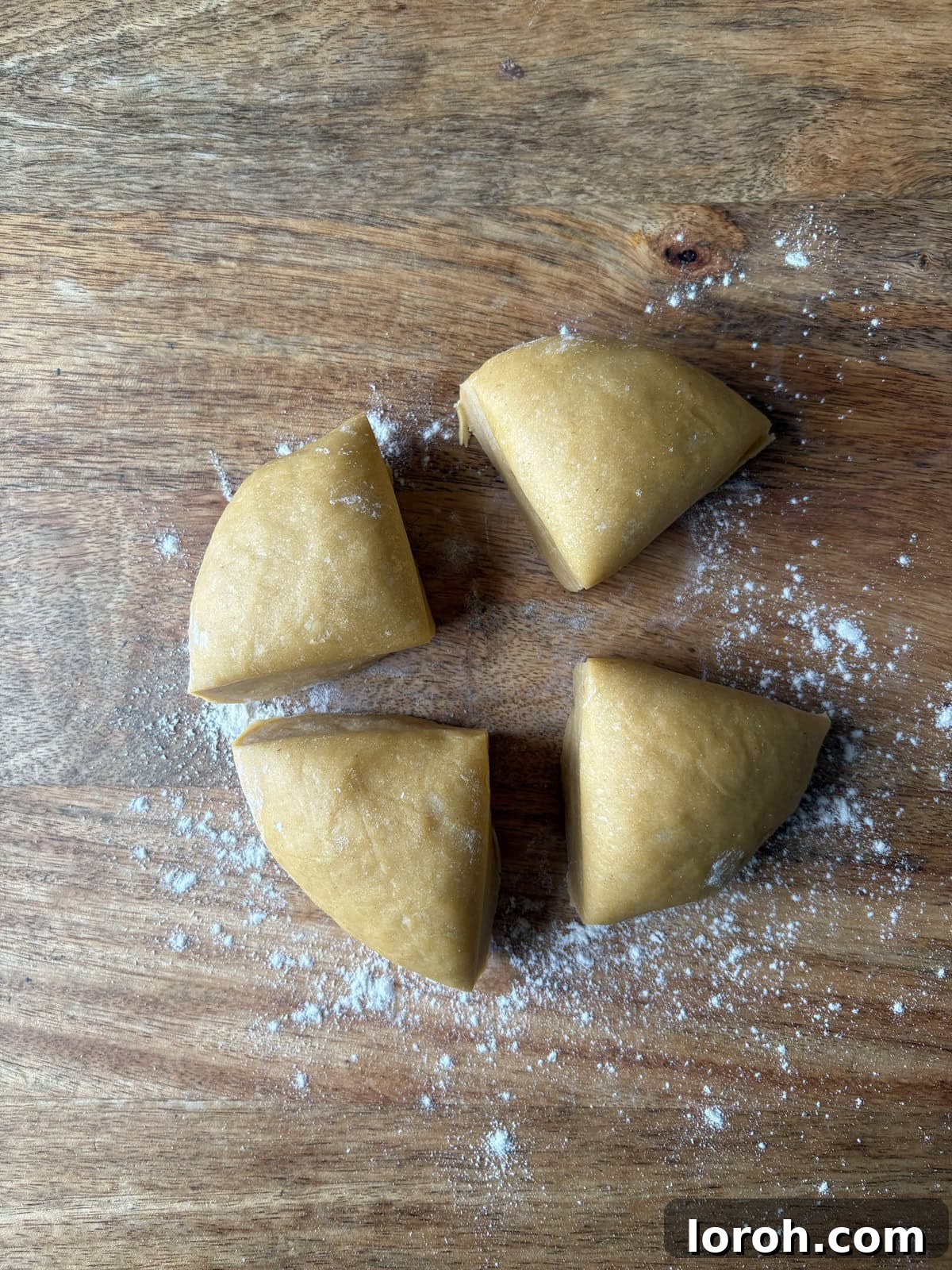 The Art of Homemade Pasta Dough 11 separating the pasta dough into four equal quarters.