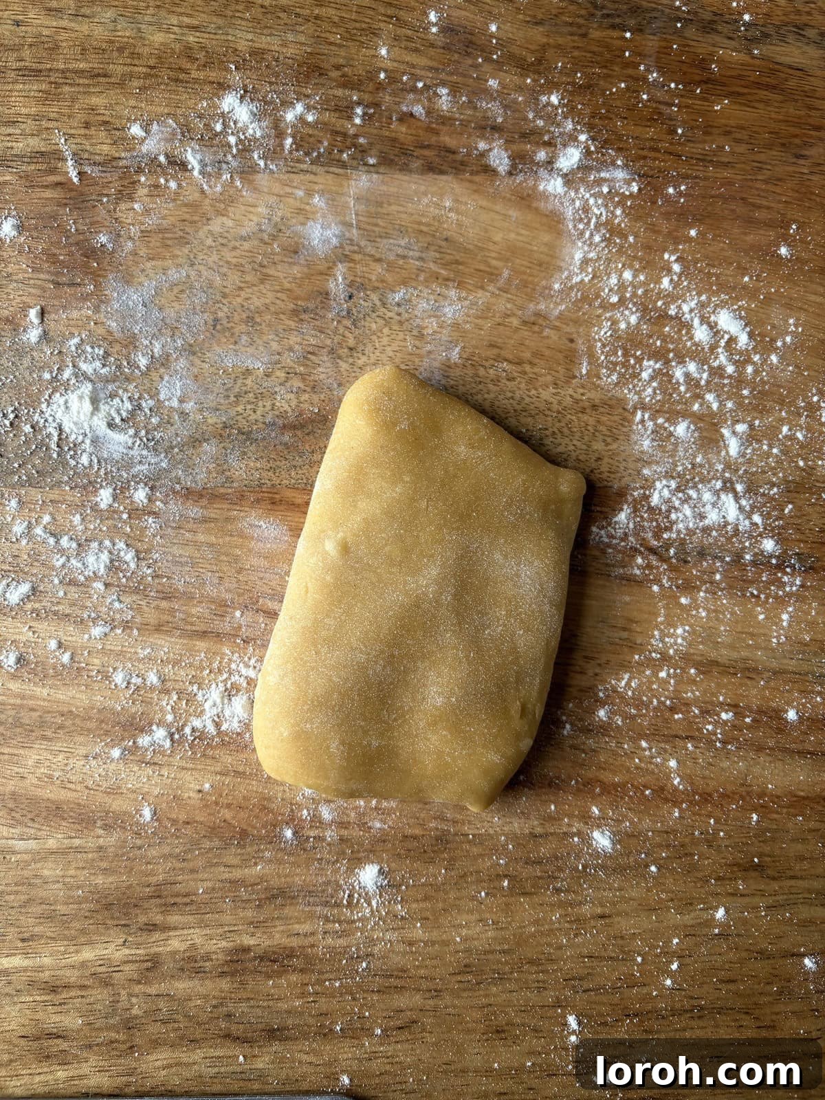 The Art of Homemade Pasta Dough 12 rolling the dough into rectangles before passing through a pasta machine.