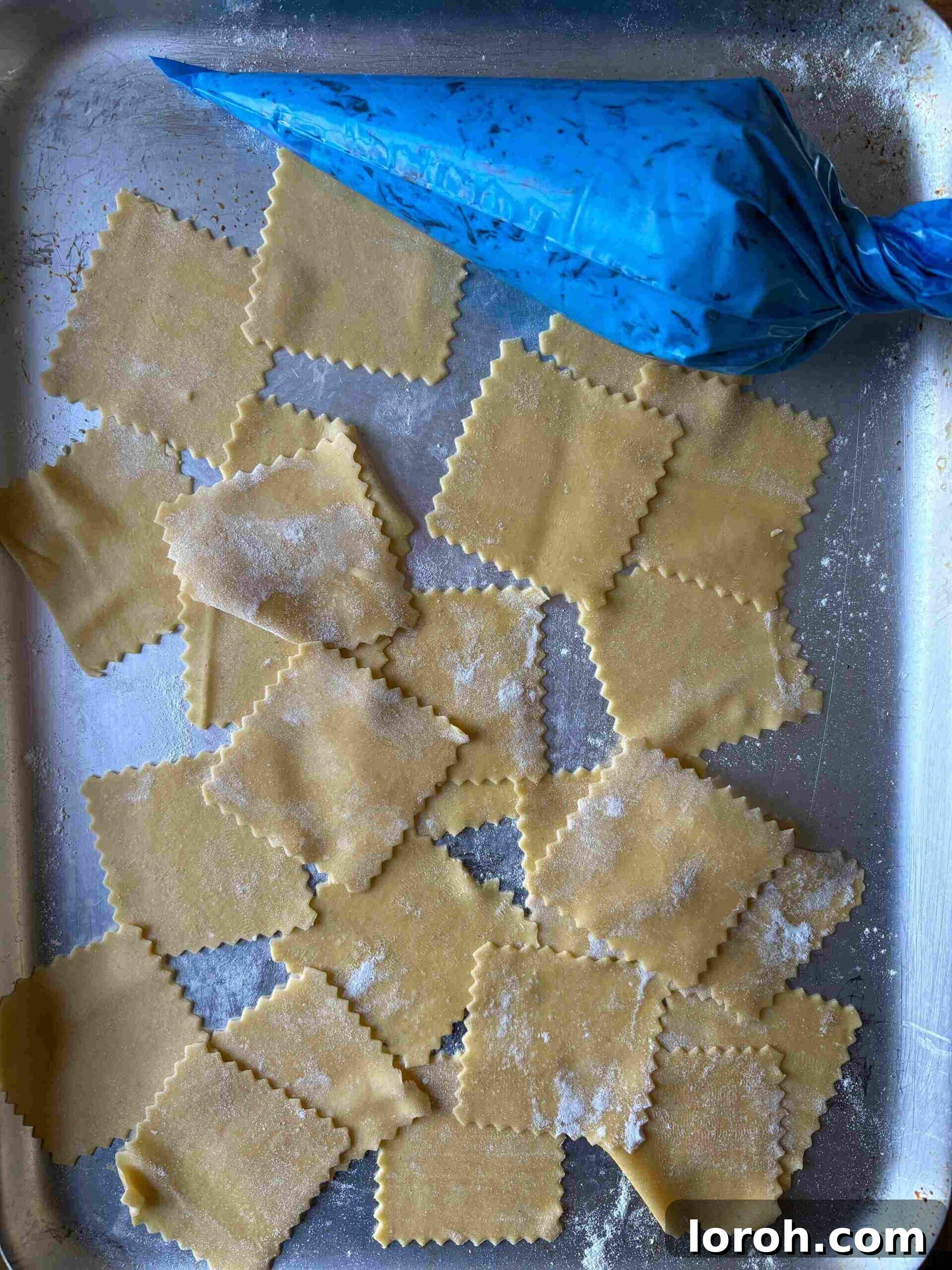 Crafting Delicious Triangoli Pasta From Scratch 8 Sheets of pasta cut into squares before filling.