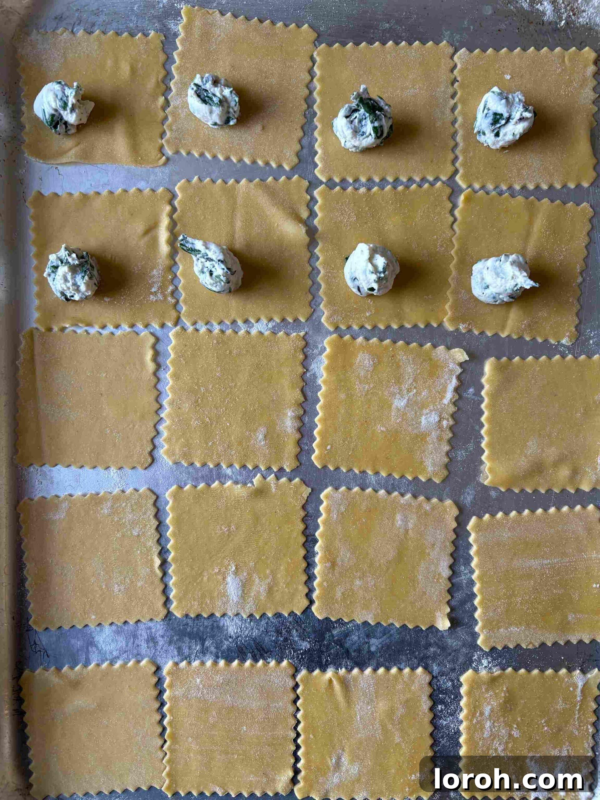 Crafting Delicious Triangoli Pasta From Scratch 9 Filling triangoli with spinach ricotta mixture.