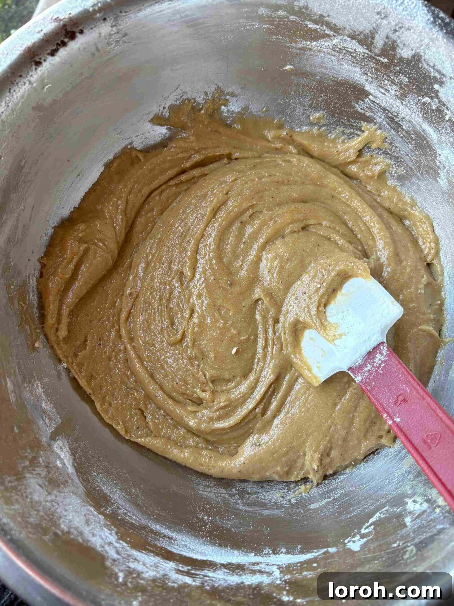 Ultimate Chocolate Chip Cookie Bars 12 Sifting flour and leavening agents into the cookie bar dough.