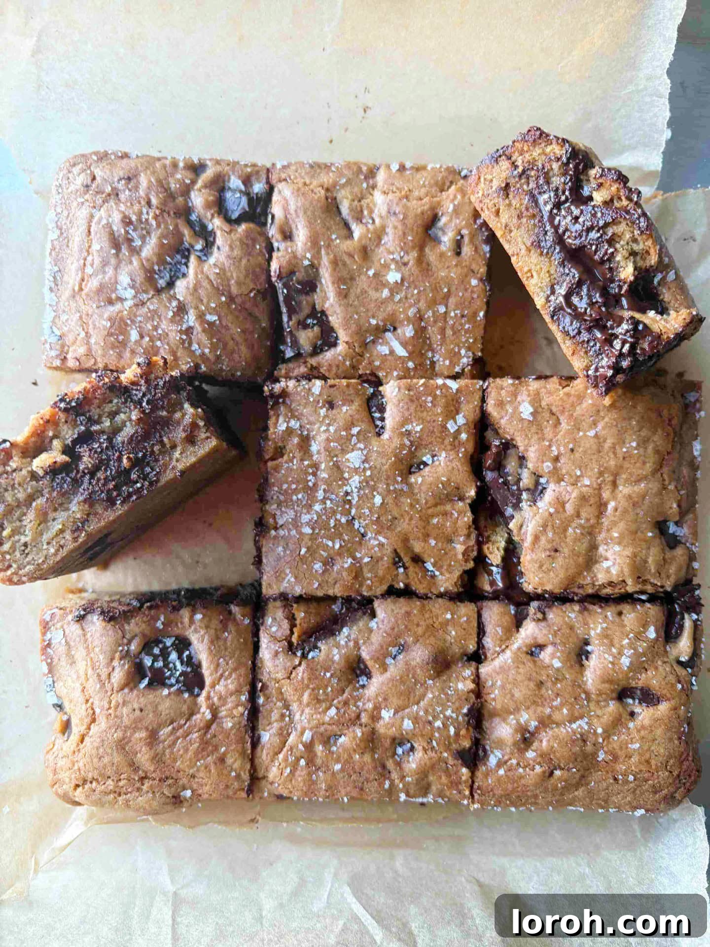Ultimate Chocolate Chip Cookie Bars 4 Freshly baked chocolate chip cookie bars cooling on greaseproof paper.