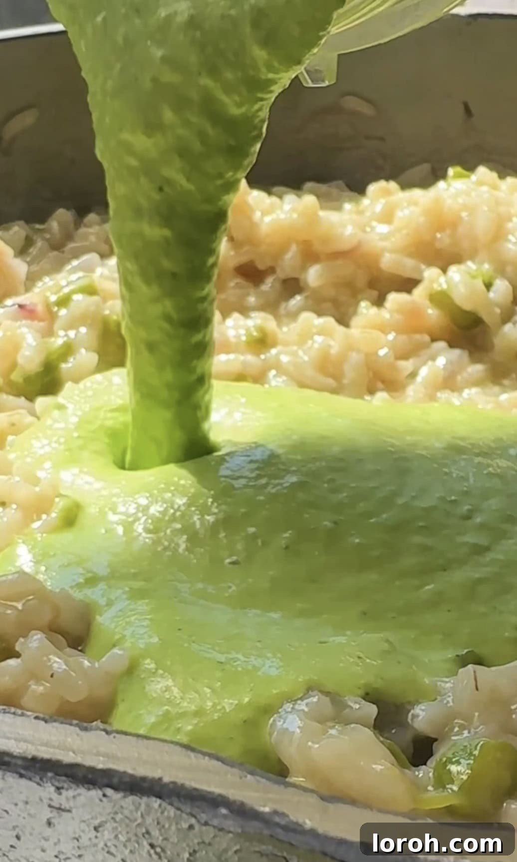 Vibrant Spring Asparagus Risotto 11 Adding the blended pea mixture to the cooked asparagus risotto in the pan, prior to final stirring.