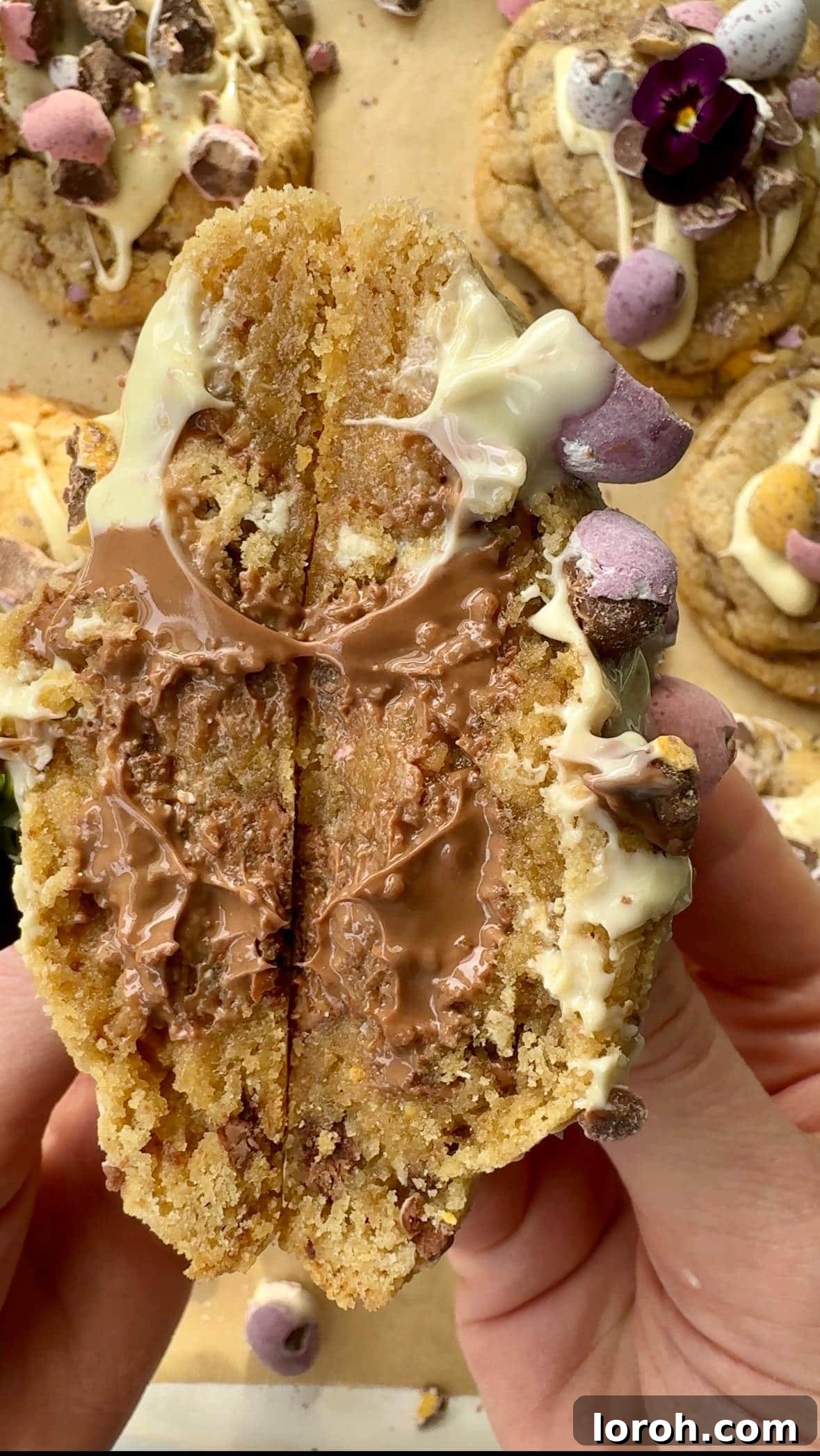 Speckled Egg Delights 3 cross section of mini egg cookies, showcasing the gooey chocolate and crushed mini eggs within.