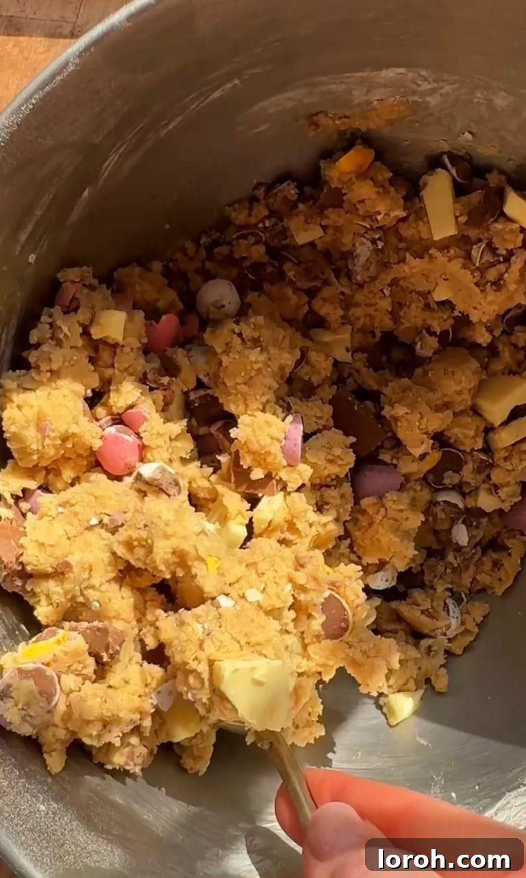 Speckled Egg Delights 7 folding chopped chocolate and crushed mini eggs into the cookie dough.
