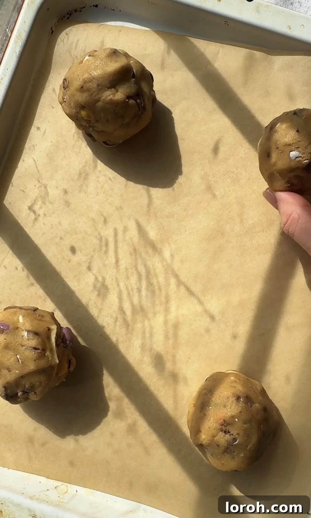 Speckled Egg Delights 8 rolling cookie dough into balls and placing them on a baking sheet.