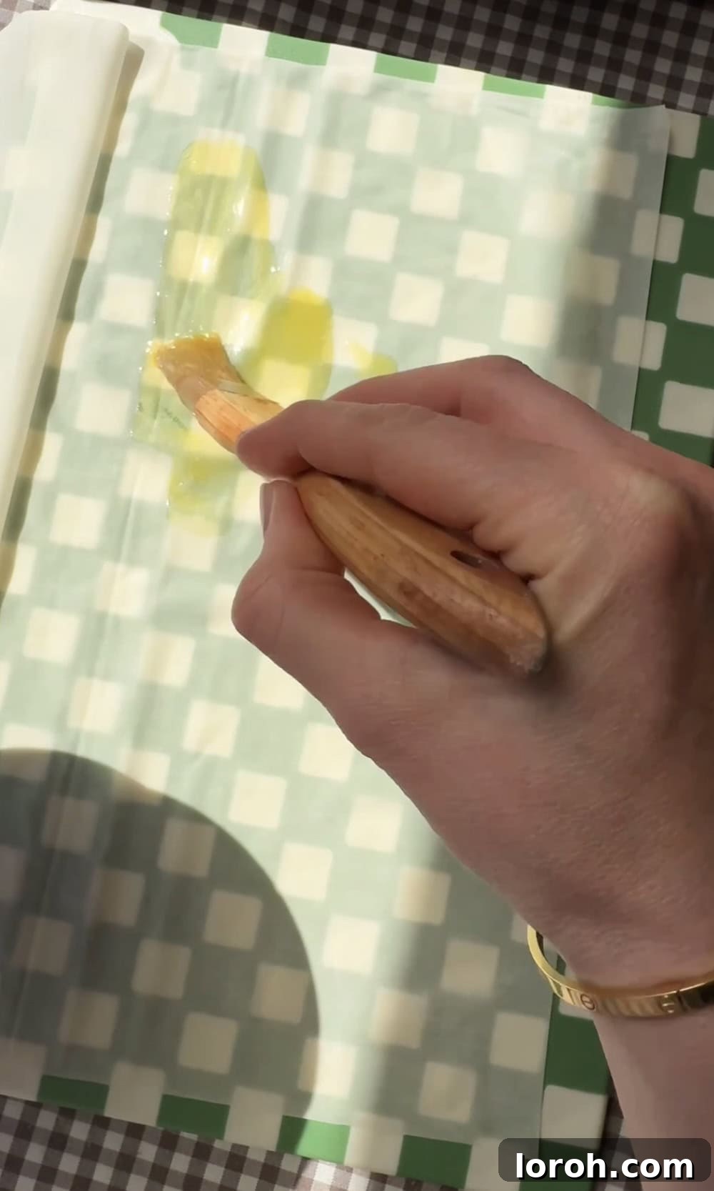 Flaming Feta Saganaki 4 Brushing filo pastry generously with melted butter