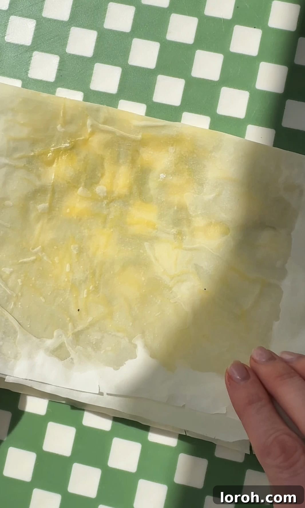 Flaming Feta Saganaki 7 Folding the filo pastry in half to adjust its size for the feta block