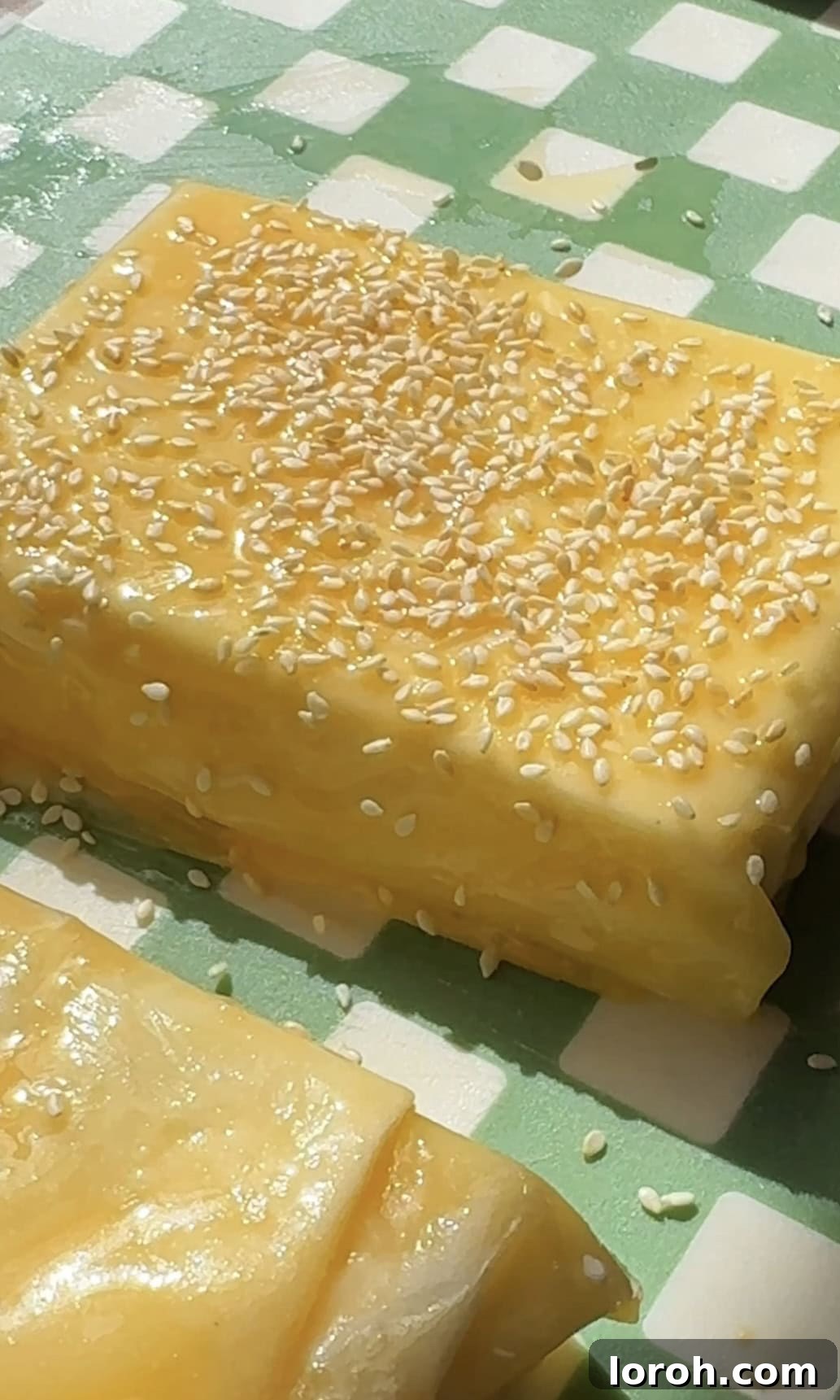 Flaming Feta Saganaki 10 Brushing the feta saganaki parcel with beaten egg yolk and sprinkling with sesame seeds
