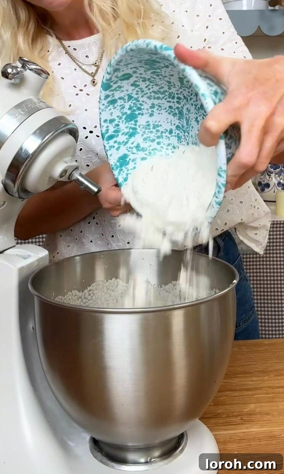 Adding flour, baking powder, and salt to the berry cake batter.