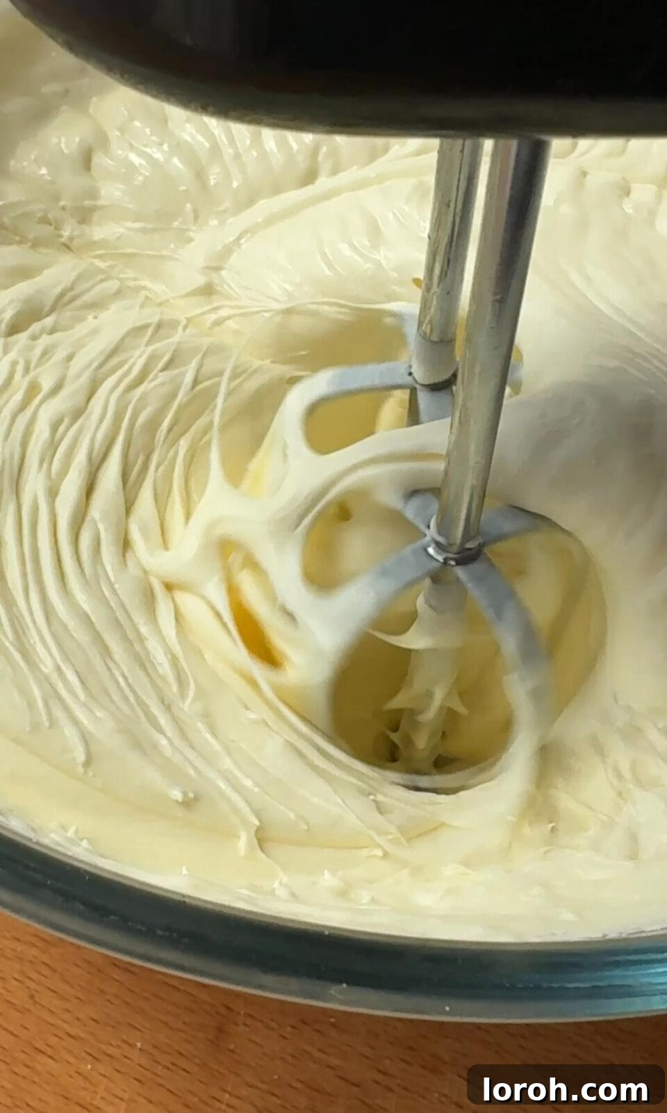 Whipping double cream and icing sugar to medium peaks for the strawberry sandwich filling.