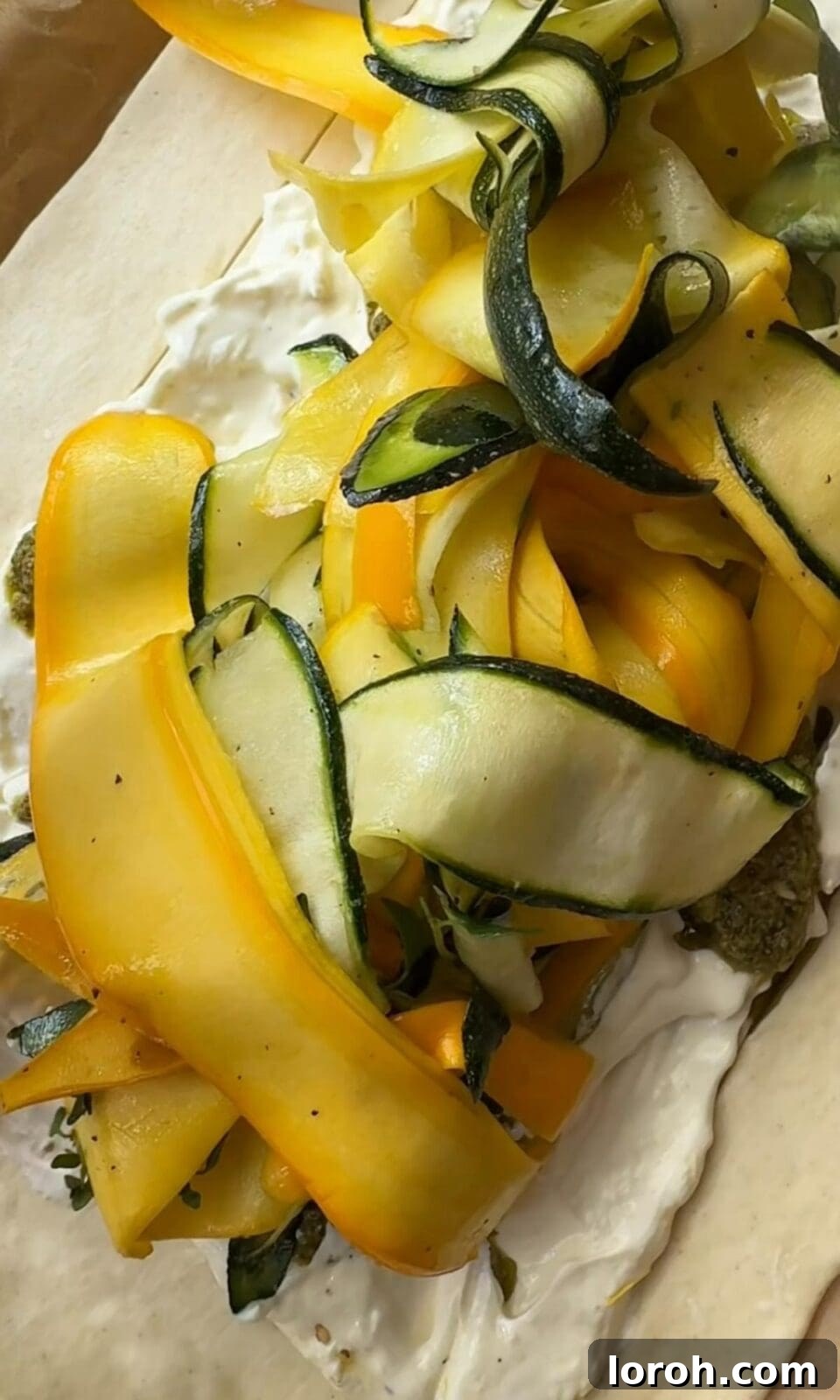 Golden Zucchini Tart 9 The tart base covered with green pesto, then topped generously with arranged courgette ribbons.
