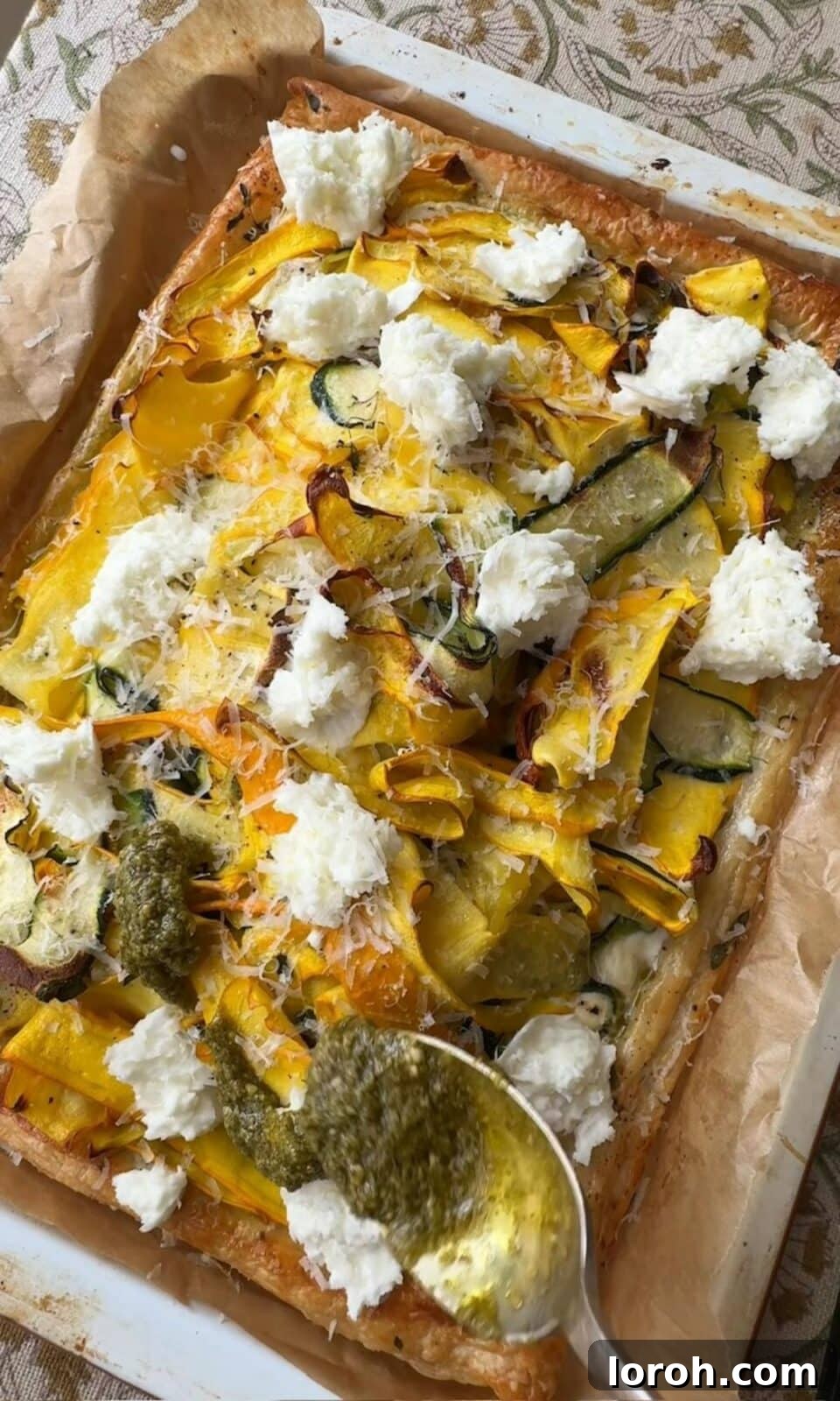Golden Zucchini Tart 10 Baked courgette tart drizzled with fresh pesto, topped with extra mozzarella and toasted pine nuts.